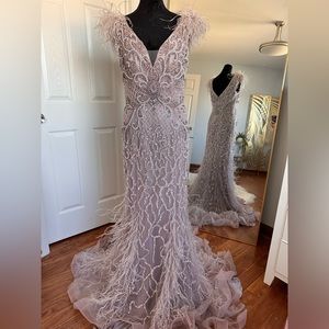 Heavily beaded mauve dress with feather detailing